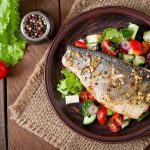 Baked,Seabass,With,Greek,Salad.,Top,View