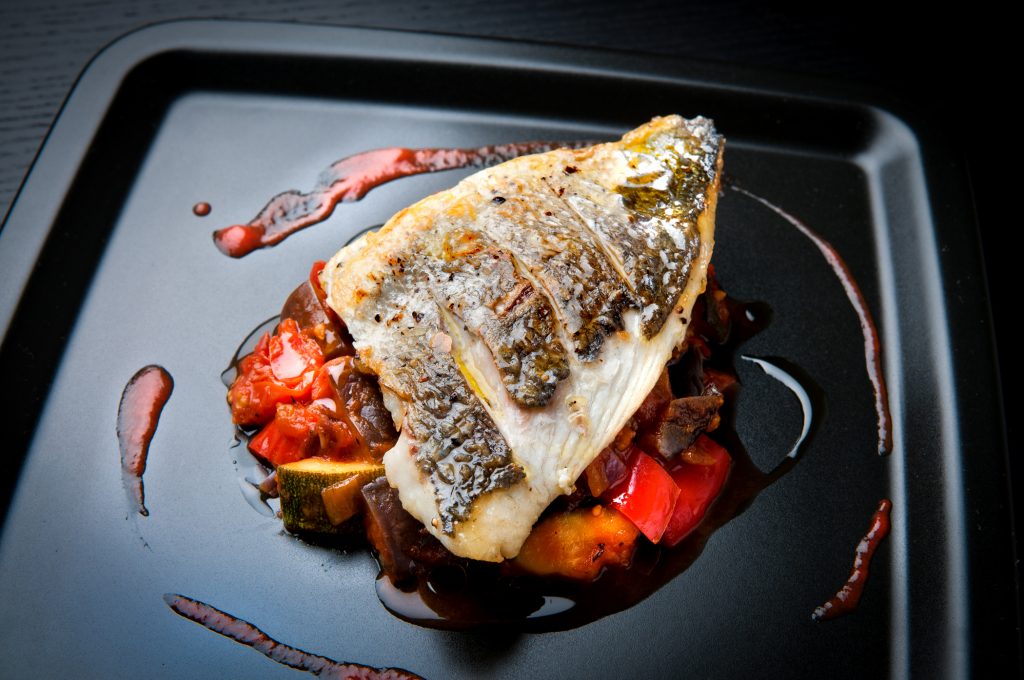 Grilled,Sea,Bream,Fillet,On,Ratatouille,With,Cherry,Tomato,Coulis